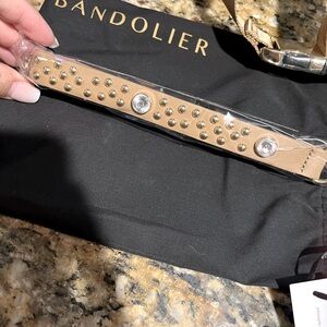 Bandolier Ava Wristlet in Tan, new in original dust bag and box.
